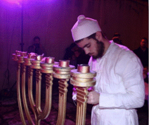 A Jewish priest with a menorah replica. (Courtesy Yaki Savir)