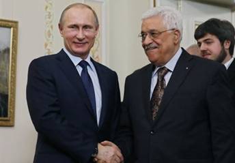 Russian President Vladimir Putin (L) shakes hands with his Palestinian counterpart Mahmud Abbas during their meeting at the Novo-Ogaryovo residence outside Moscow on April 13, 2015. (Photo credit: AFP/ POOL / SERGEI ILNITSKY)