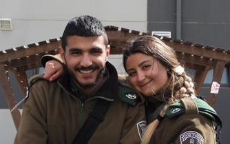 Yezen Falah and Shirel Abukarat, two Border Police officers killed in a terror attack in Hadera, are seen at their base near the West Bank settlement of Bet El, hours before they were killed on March 27, 2022. (Israel Police)